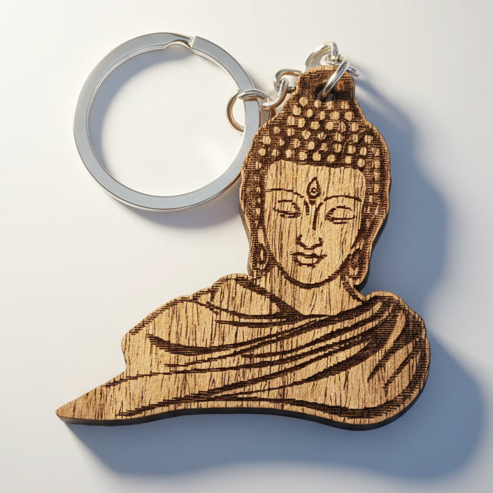 Wooden Buddha keychain with detailed engraved meditation design and metal keyring