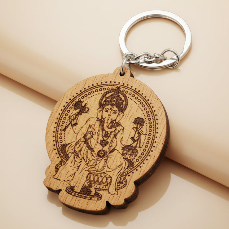 Wooden Lord Ganesha keychain with detailed engraved Hindu deity design and metal keyring