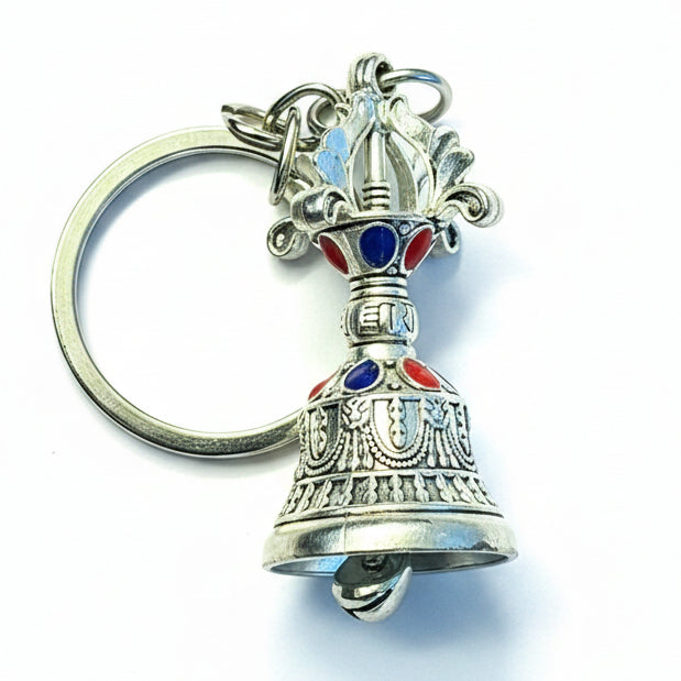 Silver Tibetan-style decorative bell keychain with red and blue accents