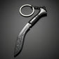 Black decorative Nepali khukuri keychain with engraved curved blade