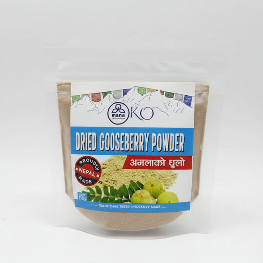 Front packaging of Mana KO Dried Gooseberry Powder (100g) featuring fresh green amala berries and Himalayan mountain sketches.