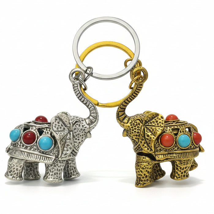 Decorative elephant keychains in silver and gold with colorful red and turquoise accents