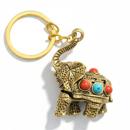 Gold-tone decorative elephant keychain with colorful stone-style accents