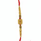 Gold square designer rakhi with red thread and intricate detailing