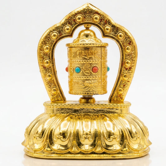 Gold solar powered rotating Tibetan Buddhist prayer wheel with lotus base