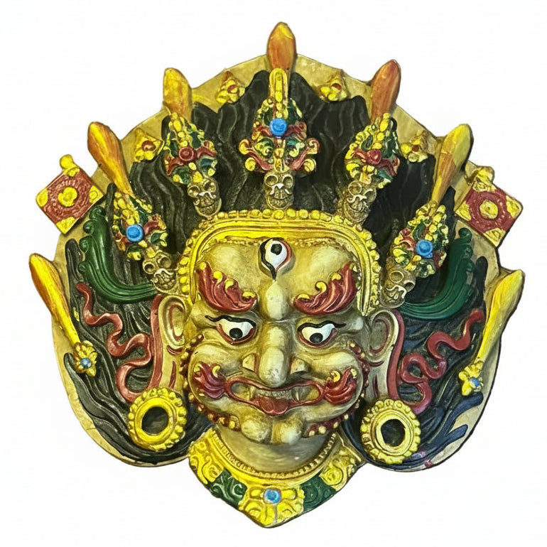 Handcrafted clay Yellow Bhairav mask with third eye, ornate crown and colorful traditional Nepali detailing