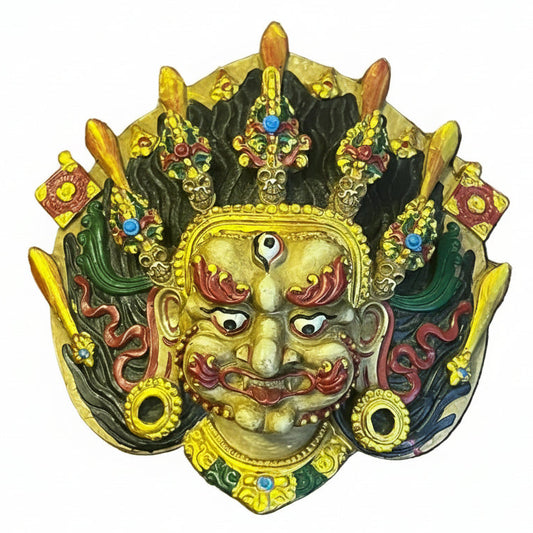 Handcrafted clay Yellow Bhairav mask with third eye, ornate crown and colorful traditional Nepali detailing