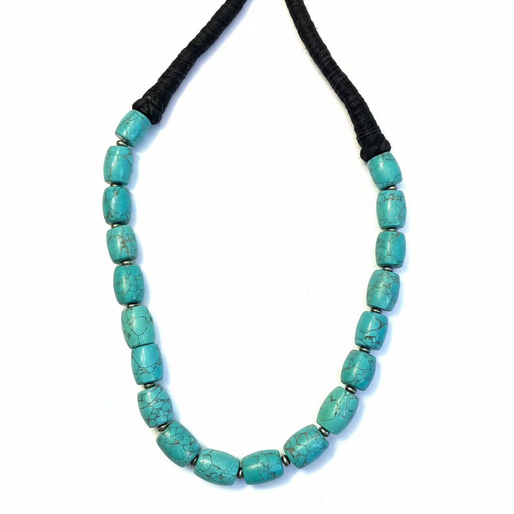 Himalayan-style turquoise-colored rectangular beaded necklace with black cord