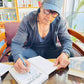 Rajesh Hamal Signing the Book Yug Dekhi Yug Samma for his readers in USA 