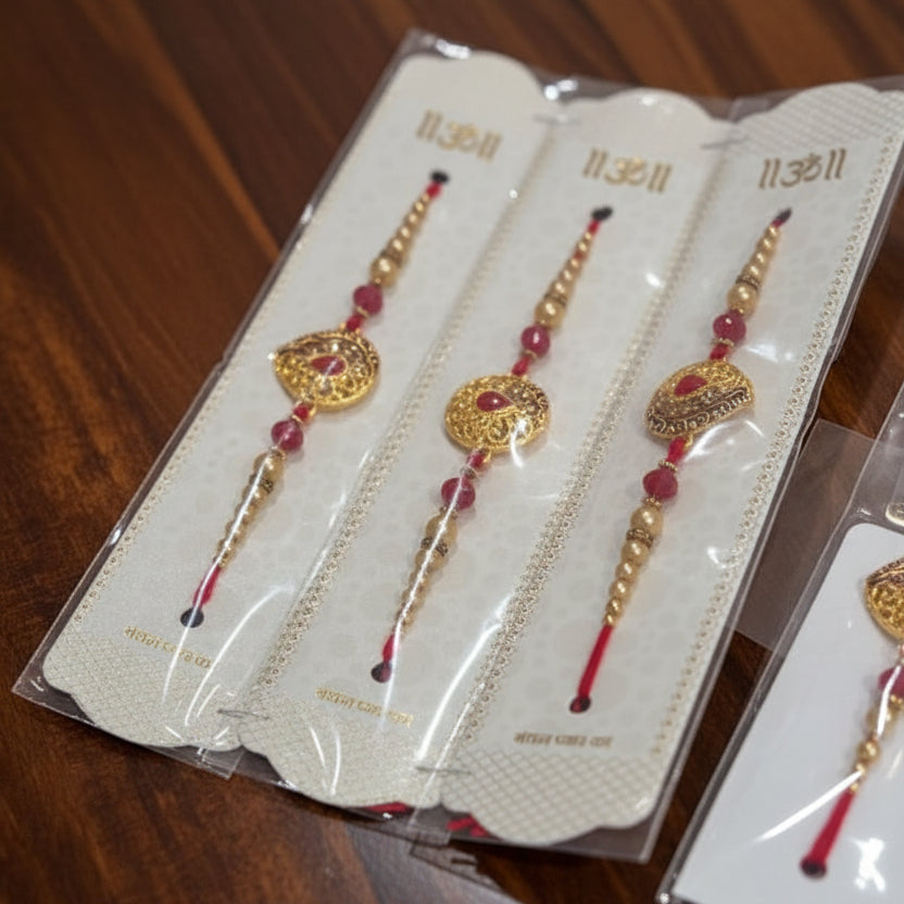 Red and gold designer rakhi set with beads and decorative centerpiece