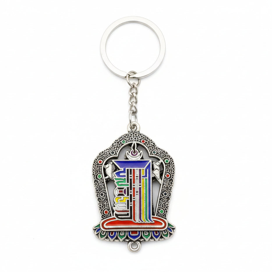 Tibetan-inspired Kalachakra symbol keychain with multicolor detailing and antique silver-tone decorative frame