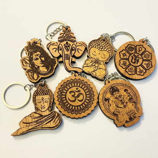 Assorted wooden spiritual keychains with Buddha, Ganesha, Shiva, Om and engraved deity designs