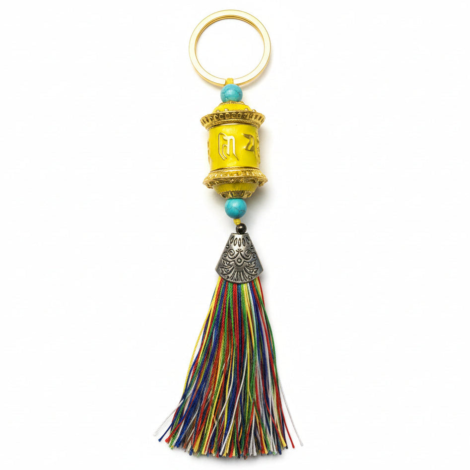Yellow Tibetan prayer wheel keychain with multicolor tassel
