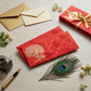 Detailed red gift envelope showcasing an intricate gold-foiled peacock and tree design on a floral background.